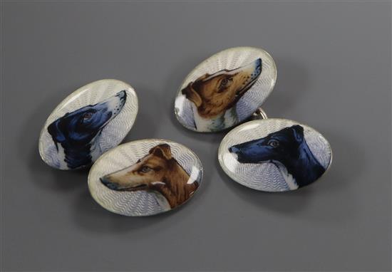 A pair of sterling and enamel oval cufflinks, decorated with the heads of greyhounds.